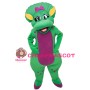 Cartoon Green Dinosaur Lady With Purple Bow Mascot Costume