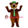Happy Brown Bear With Green Tie And Cap Mascot Costume